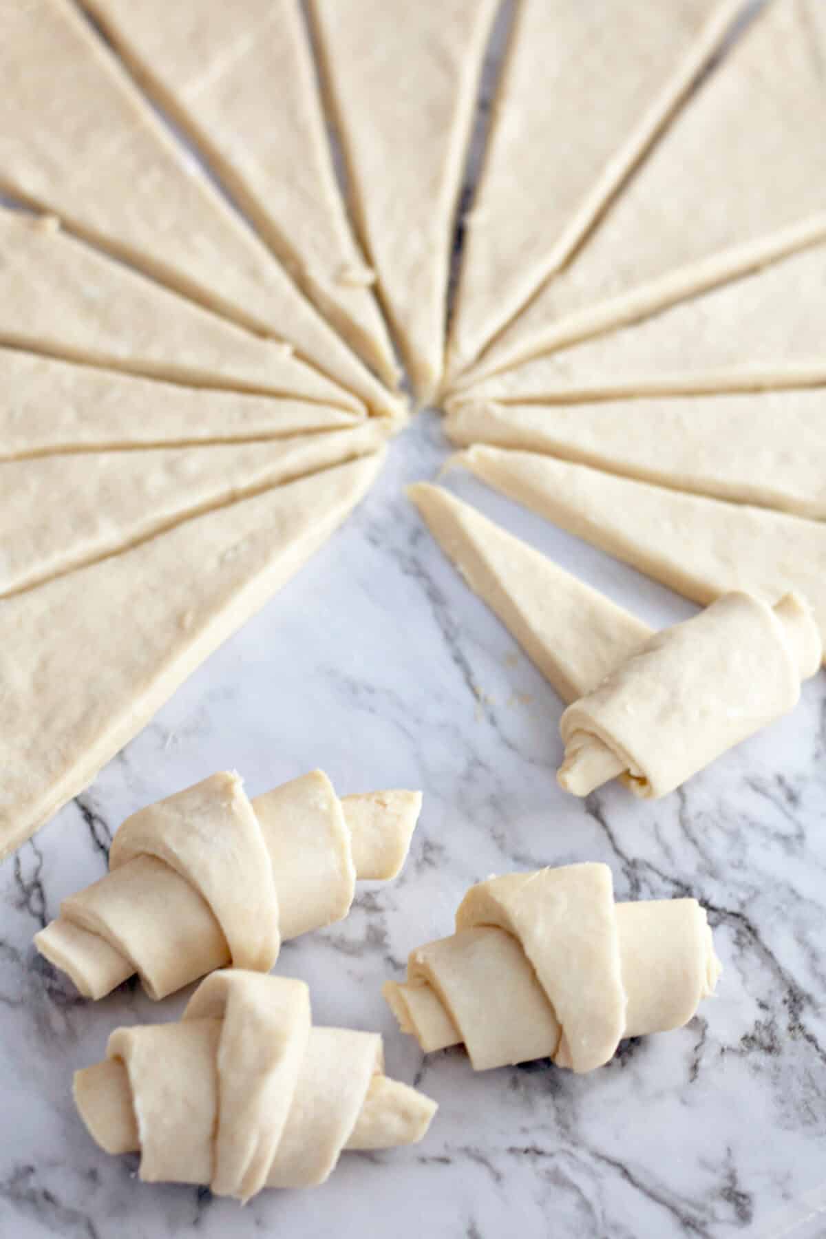 rolling triangles into crescent rolls