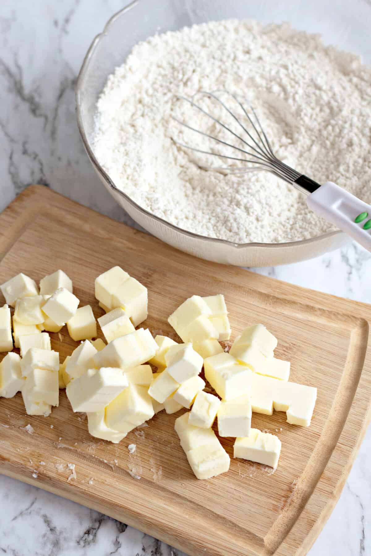cubed butter on a cutting board