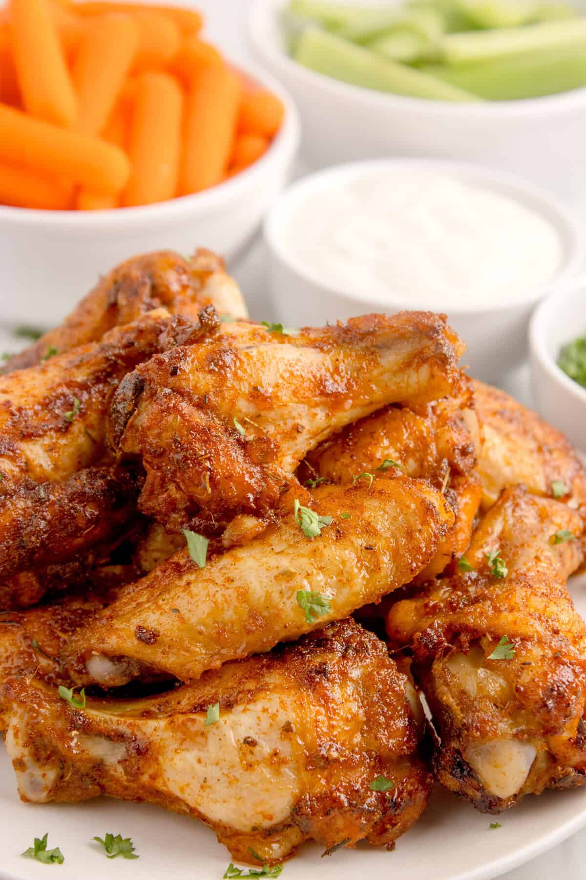 dry rub wings stacked on a plate