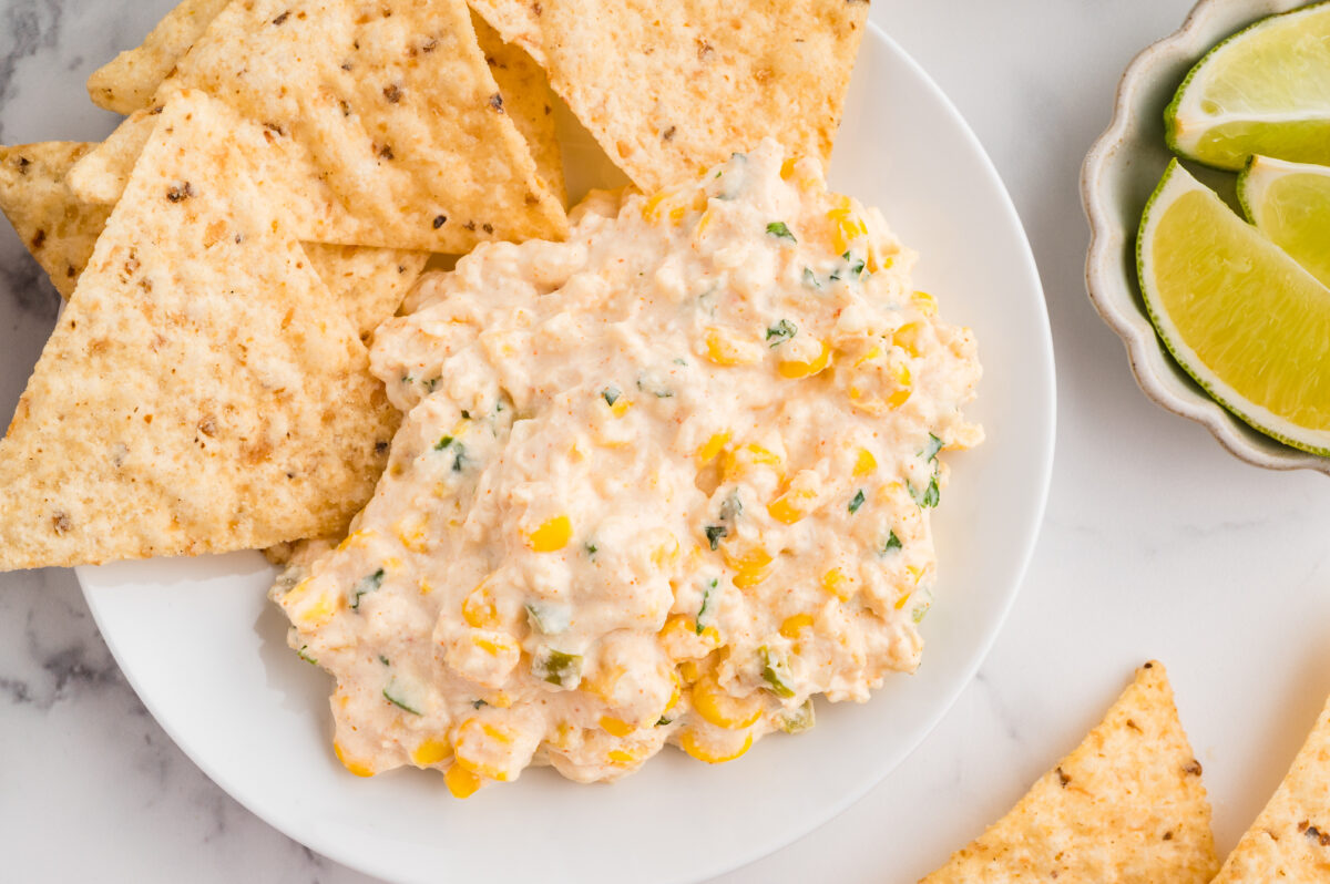 mexican street corn dip in a bowl with tortilla chips