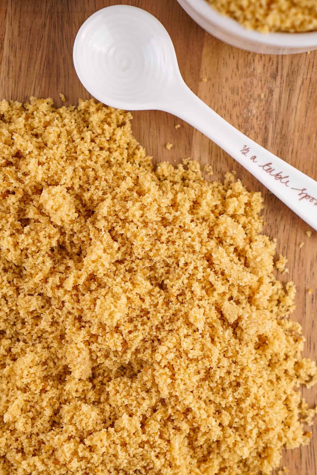 homemade brown sugar on a cutting board with a measuring spoon