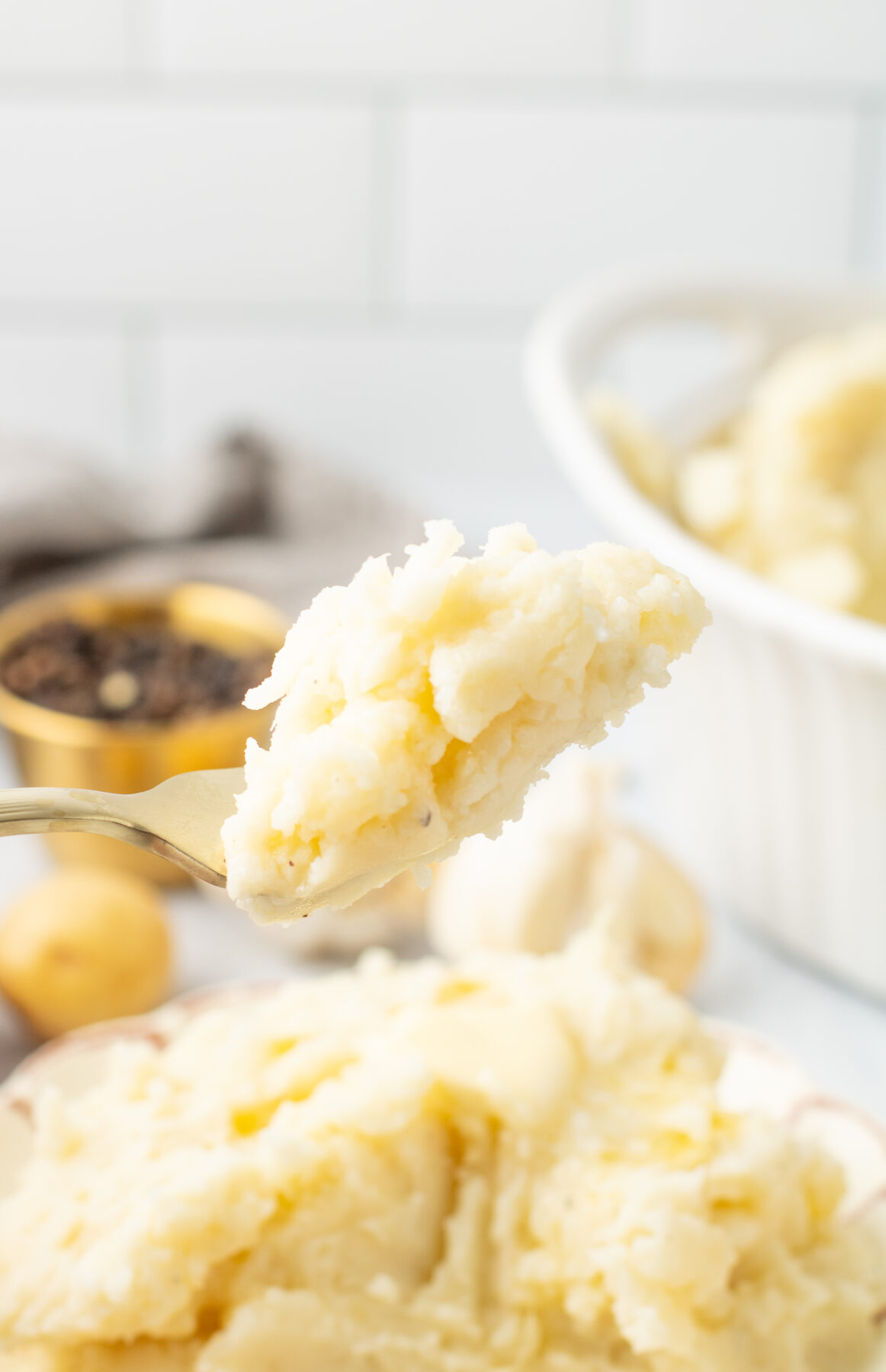 a fork of instant pot mashed potatoes