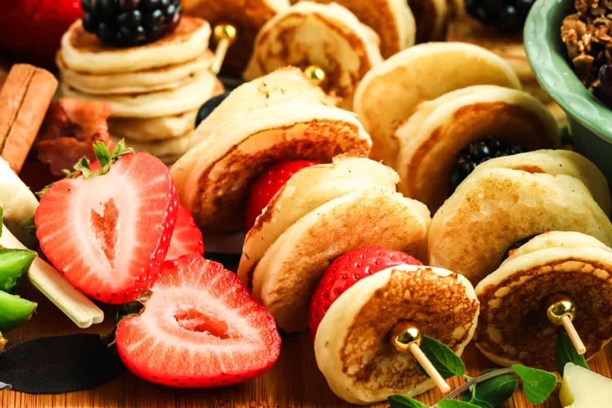 mini pancakes on a skewer with fruit