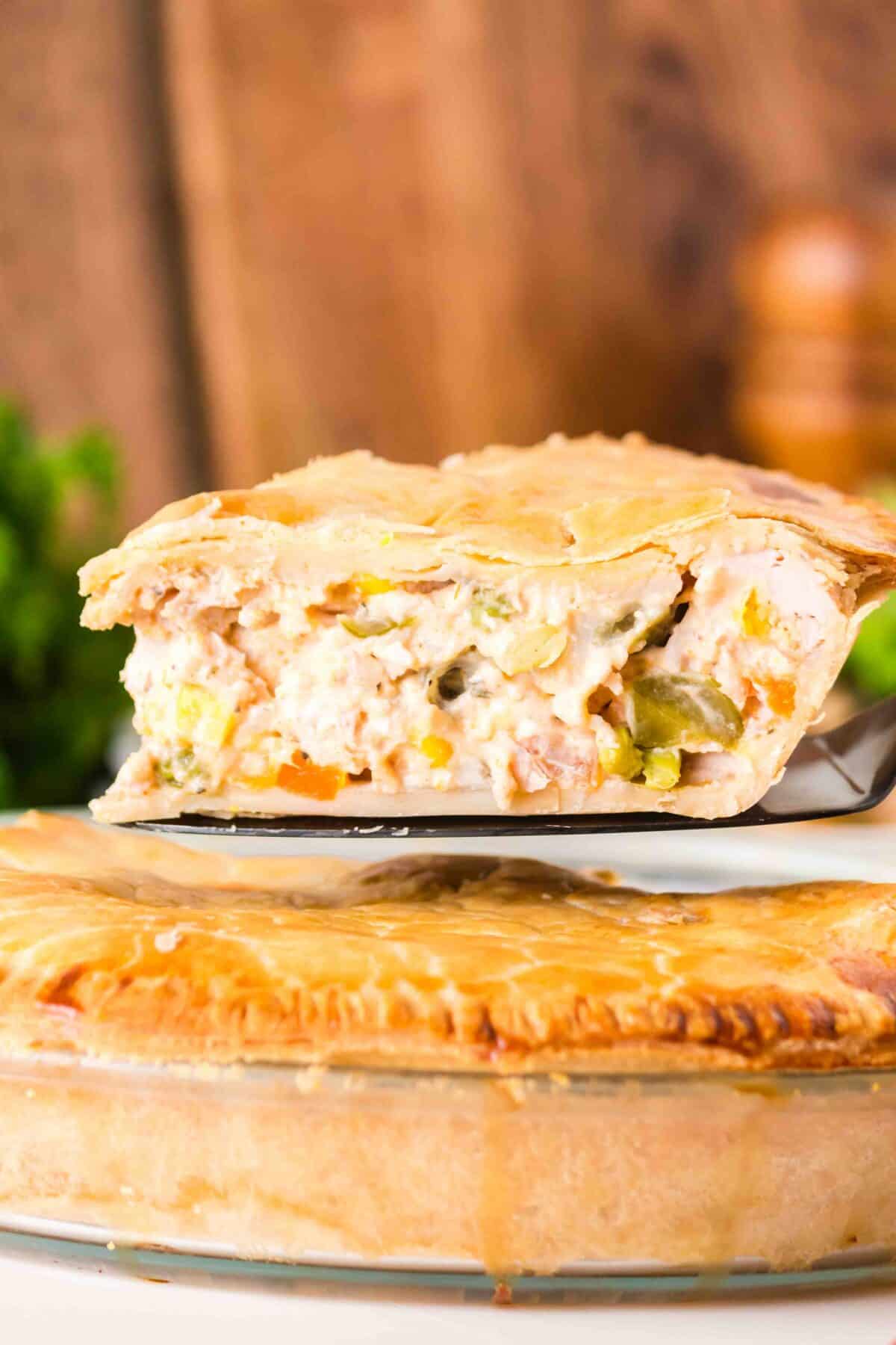 slice of turkey pot pie on a spatula