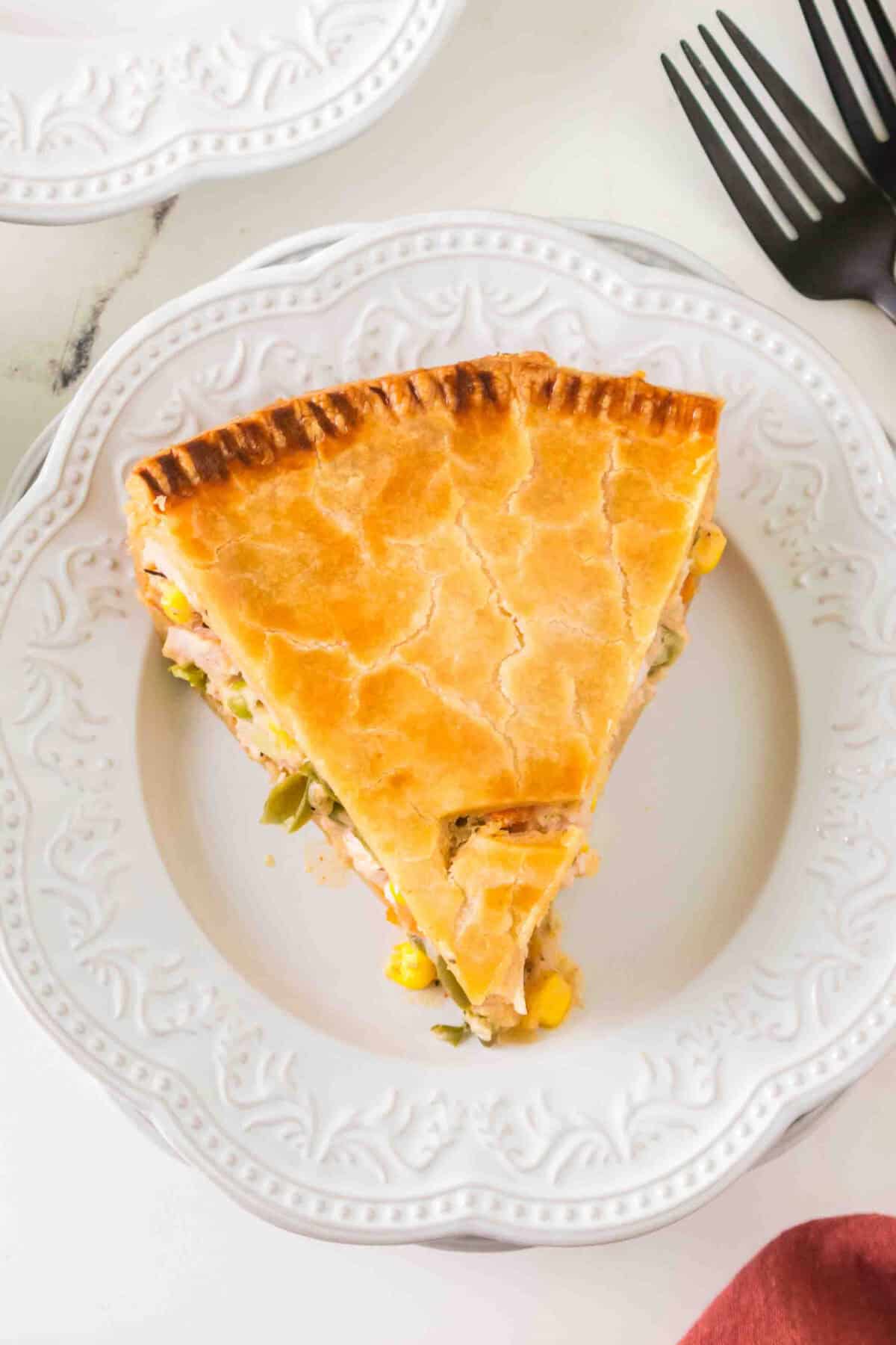 slice of turkey pot pie from above on a white plate