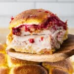 turkey sliders being lifted out of dish