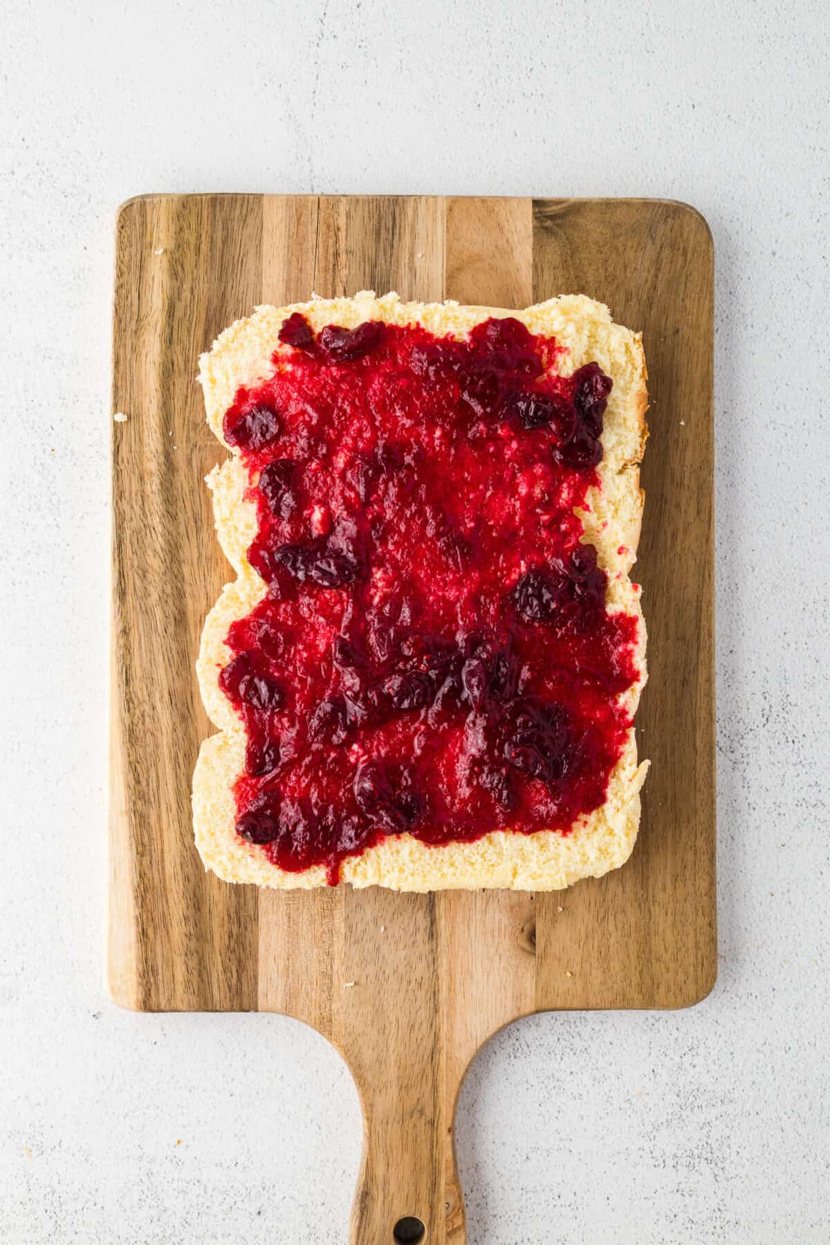 cranberry sauce spread on rolls