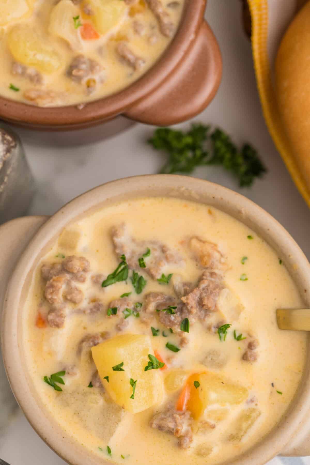 cheeseburger soup topped with crispy onions